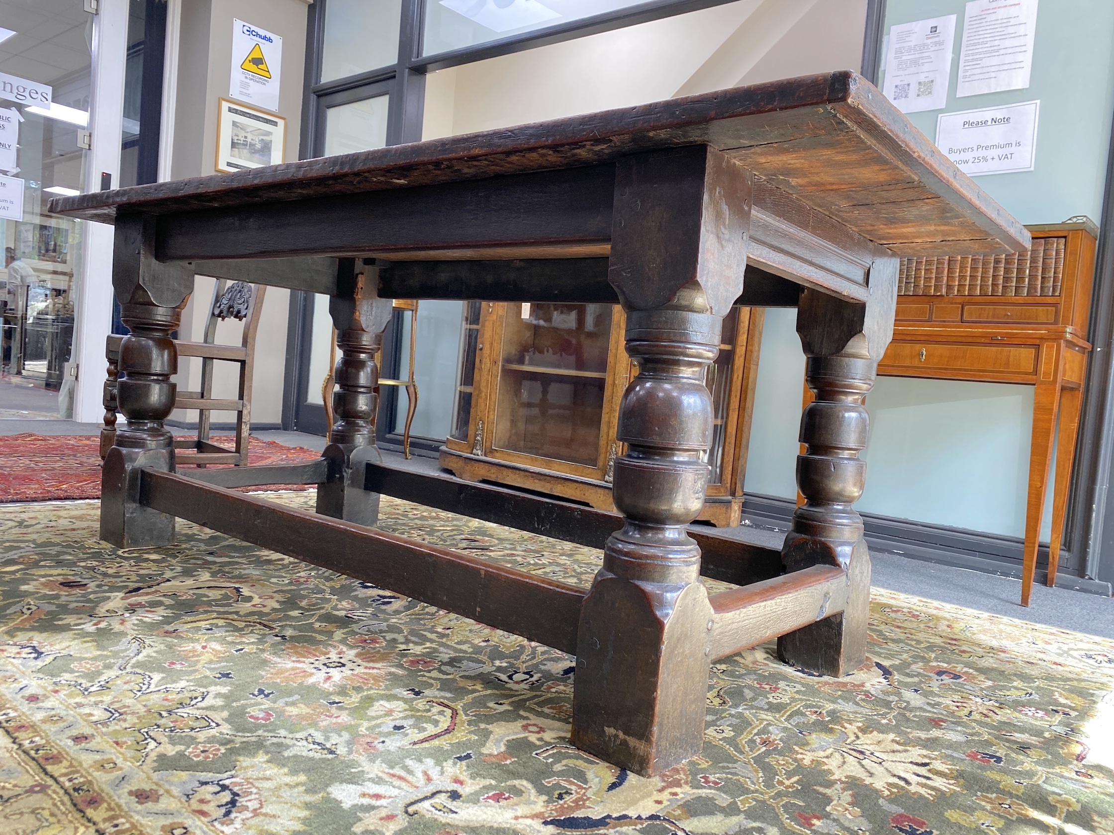 An 18th century and later rectangular oak refectory dining table, length 194cm, width 83cm, height 79cm and two Derbyshire style oak chairs